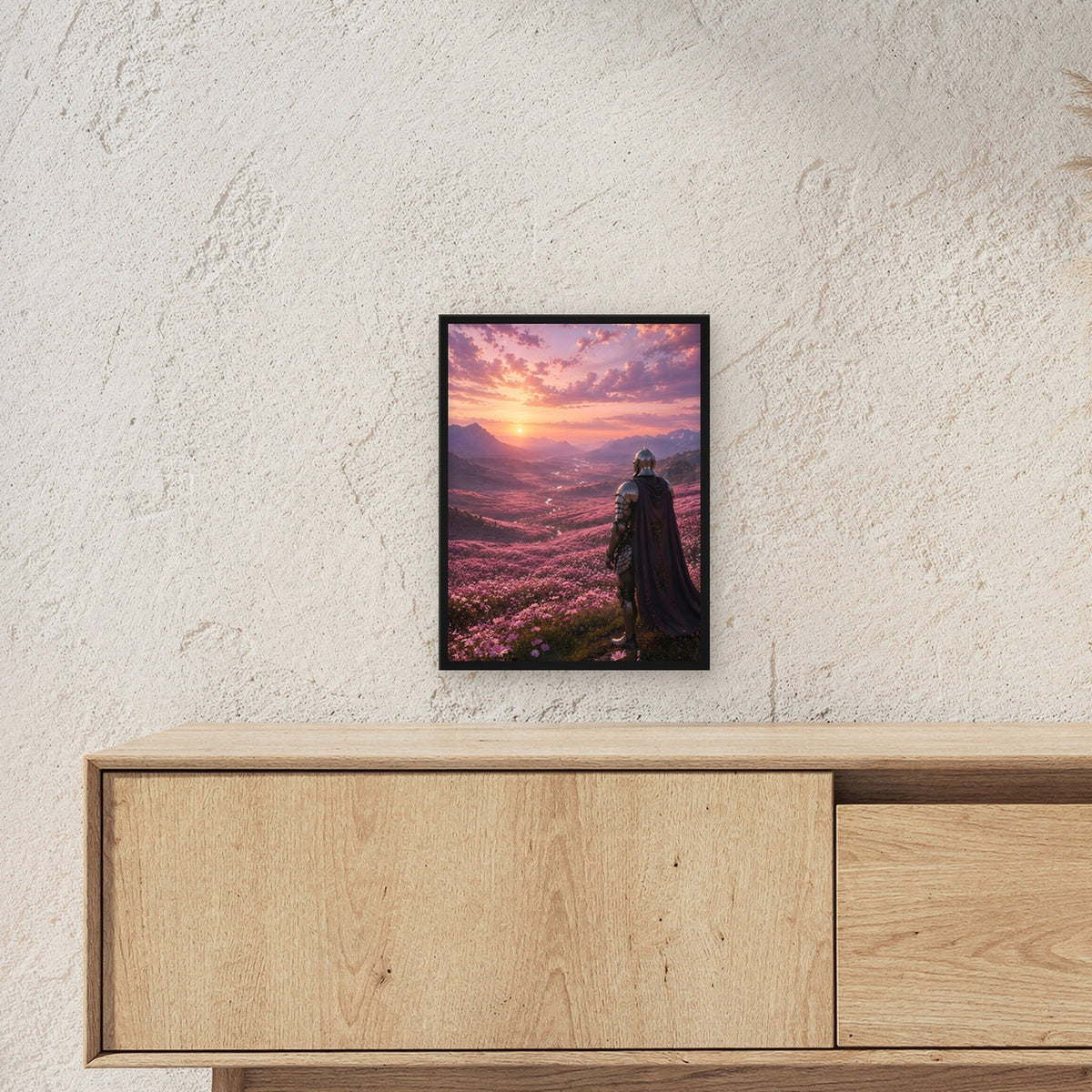 Ritter über purpurnem Blütental, Fantasy Wandbild gerahmt im schwarzen Holzrahmen ueber einem Sideboard, zeigt die Groesse im Raum