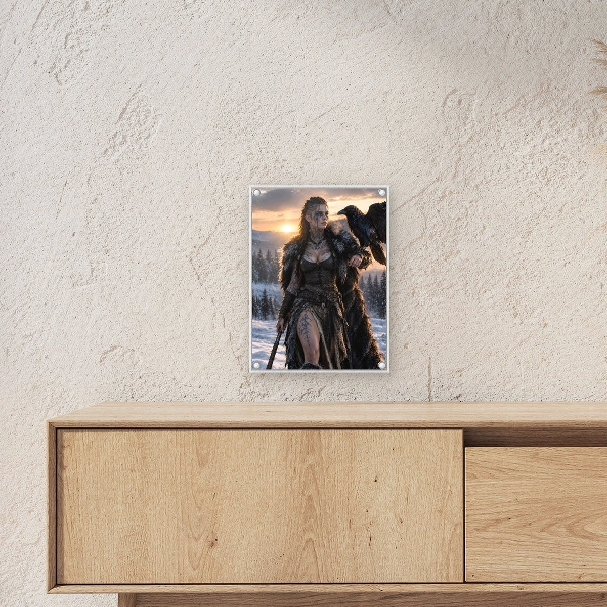 Schildmaid mit Rabe auf der Hand im Abendlicht, Dark Fantasy Acrylglasbild auf Acrylglas mit Edelstahl-Abstandshaltern ueber einem Sideboard, zeigt die Groesse im Raum
