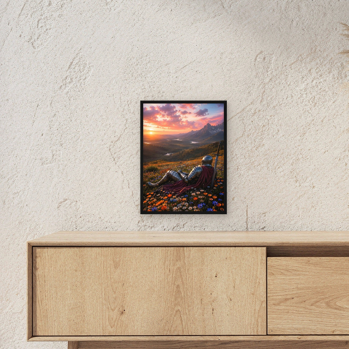 Ritter rastet im Blütenmeer, Mittelalter Fantasy Wandbild gerahmt im schwarzen Holzrahmen ueber einem Sideboard, zeigt die Groesse im Raum